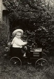 Automobilia Prints: Young boy in an elegant toy car