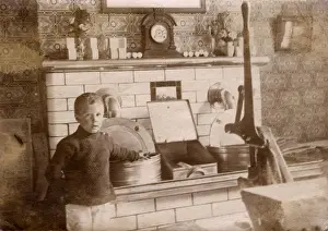 Dec18 Prints: Young boy and hot fat fryers - Fish & Chip Shop, Morecambe