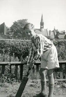 Batsman Prints: A Young boy playing cricket in a suburban garden - he awaits for a delivery to arrive