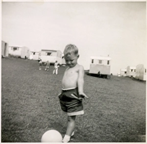 Nov15 Gallery: Young boy plays with a football at a holiday camp