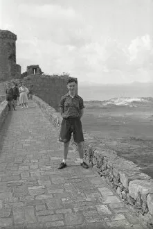 Images Dated 7th January 2020: Young boy standing on the ramparts of Harlech Castle