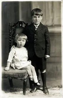 Young Boy and younger sister - studio portrait photograph