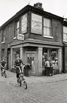 Cycles Collection: Young boys outside corner shop off-licence, Salford