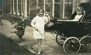 Pram Collection: Two young children at Hampton Court Castle, Herefordshire