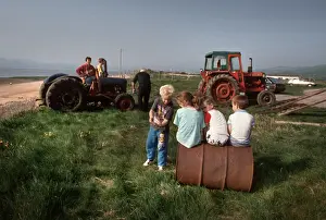 Barrow Prints: Young children play and men work on tractors - Askam, Cumbria