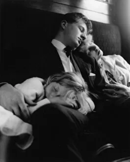 Images Dated 26th May 2017: Young couple and child sleeping in a train compartment
