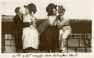 Two young couples sharing a seaside cuddle
