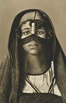 A young Egyptian woman in traditional headdress