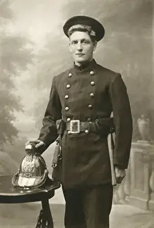 Ealing Prints: Young fireman in studio photograph