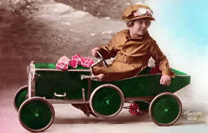 Spare Prints: Young French girl driving her green pedal car