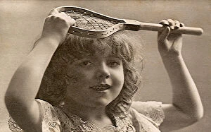 Lifestyles Collection: Young girl holding very little tennis racquet Date: 1905
