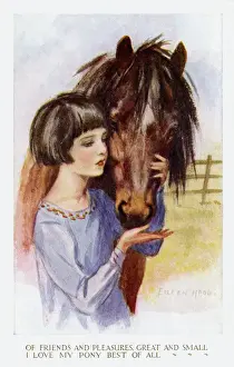 Young girl petting pony