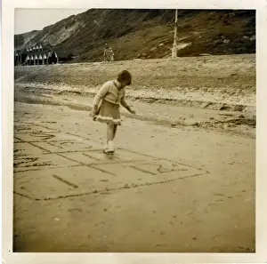 Hopscotch Prints: Young Girl Playing Hopscotch on the Beach, Boscombe, Hampshi