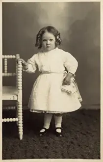Curled Prints: Young girl in pretty white dress
