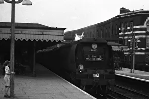 Images Dated 27th April 2021: Young girl watches arrival of steam train