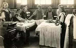 Irons Gallery: Young girls ironing in laundry room, Surrey