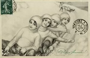Four young girls tobogganing