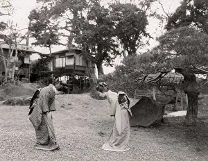 Foliage Gallery: Two young Japanese women bowing to each other, greeting