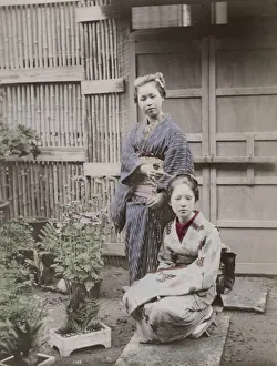 Two young Japanese women with plants