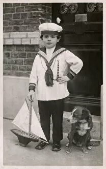 Aisne Gallery: Young lad in sailor suit with pet dog and model ship