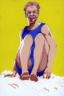 Images Dated 22nd September 2017: Young lad sitting on a sandy beach - Summer