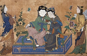 Young lady seated in a couch, surrounded by his