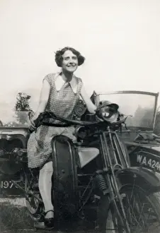 Young lady seated on a Motorbike (with sidecar) Date: circa 1930s
