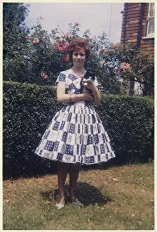 Young lady in smart summer frock - suburban garden
