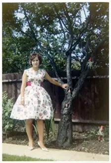 Young lady - summer frock - suburban garden - gnomes