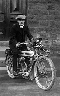 Triumph Gallery: Young man on a 1910 / 14 Triumph motorcycle