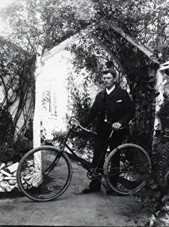 Young man and bicycle, Haverfordwest, South Wales