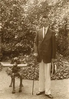 Helpful Prints: Young man with a dog in a garden
