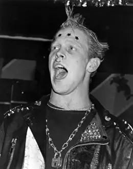 Haircut Prints: Young man at fancy dress party, dressed as a punk