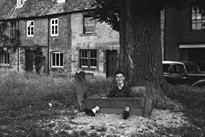 Stocks Collection: Young man fooling about in The Stocks