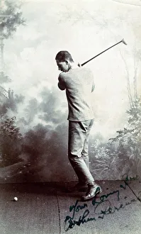 Swings Prints: A Young man playing a golf shot - studio photograph