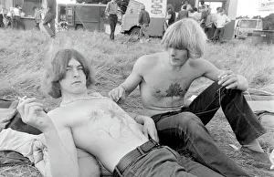 Images Dated 18th September 2015: Two young men in a field at Woburn Park