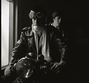 Two young men on a motorcycle