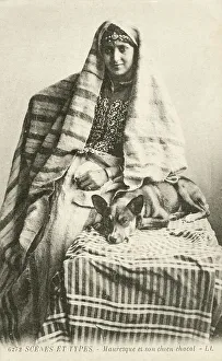 Young Moorish Woman with her jackal-type pet dog - Morocco