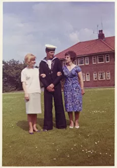 Images Dated 4th February 2021: A young naval cadet with his Mother and older sister