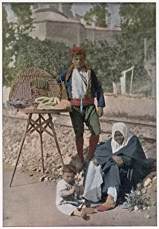 Cakes Prints: A young Turkish man selling sweets and cakes on the streets of Istanbul Date: 1890s