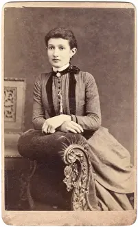 Chaise Prints: Young Victorian woman sitting on a chaise longue