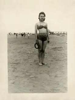 New Images From The Grenville Collins Collection Prints: Young woman on the beach in leopardprint two-piece swimsuit