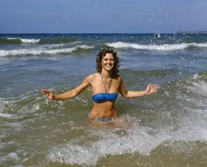 Sunny Prints: Young woman in a blue bikini, West Country
