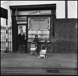Images Dated 6th October 2015: Young woman with children and toy prams