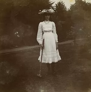 Young woman with croquet mallet, Ealing, West London