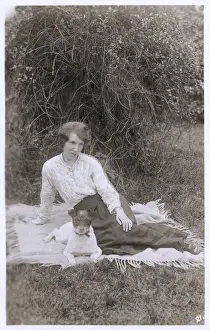 Young woman with a dog in a garden