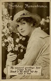 Young woman with flowers on a birthday postcard