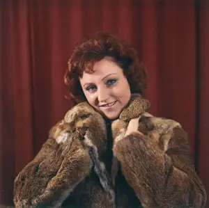 Young woman in a fur coat