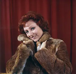 Young woman in a fur coat