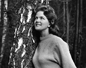 Ribbed Prints: Young woman leaning against a tree